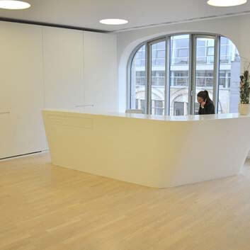 Block-shaped, spaceship-like, white, smooth, seamless Corian counter.